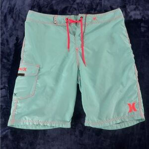 Hurley Men's Teal and Orange Board Shorts
Size 34
20”